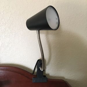 Lamp that clips onto bed